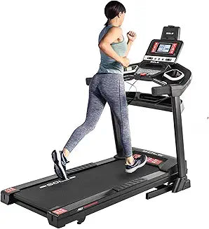 Woman exercising at home using modern fitness equipment like resistance bands and smart mats